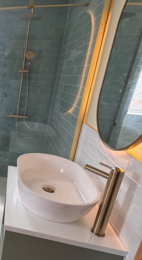 Wirral bathroom upgrade featuring Ca’Pietra tiles, floating vanity and LED mirror